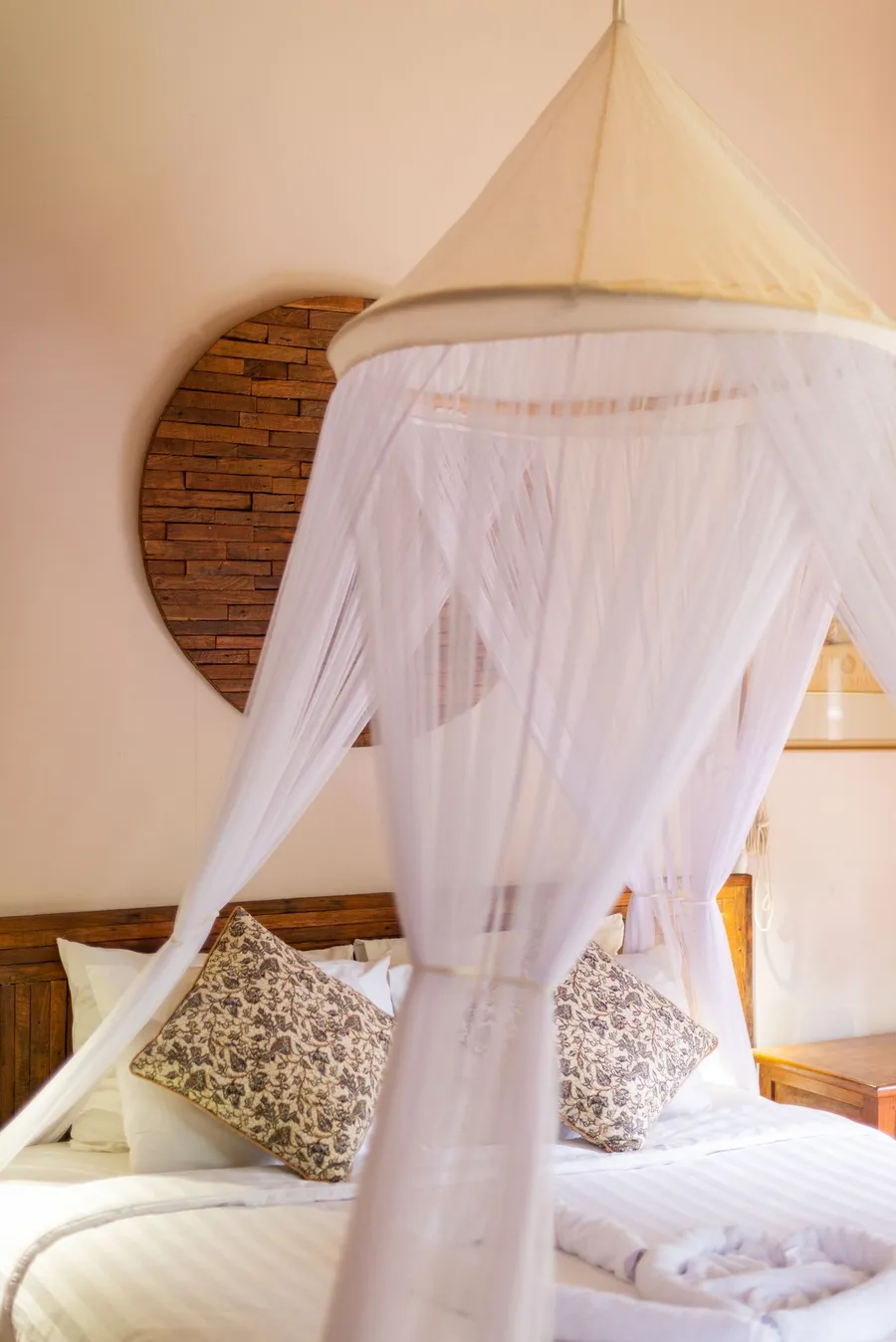 Tropical villa bedroom with a canopy bed